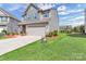 Well-maintained home with a spacious driveway and lush green lawn at 530 Silers Bald Dr, Fort Mill, SC 29715