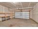 Spacious unfinished garage featuring overhead lighting and shelving, perfect for storage or projects at 530 Silers Bald Dr, Fort Mill, SC 29715