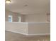 Second-floor hallway with neutral carpet and railing overlooking another space at 530 Silers Bald Dr, Fort Mill, SC 29715