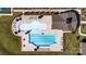 Aerial view showcasing the community pool and clubhouse with lounge chairs surrounded by lush landscaping at 535 Trading Post Ln, York, SC 29745
