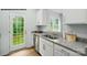 Bright kitchen features stainless steel appliances, granite countertops, and a door to the backyard at 535 Trading Post Ln, York, SC 29745