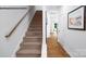 Carpeted staircase and wood floors create an inviting entryway at 535 Trading Post Ln, York, SC 29745