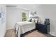 Well-lit bedroom with a modern design, featuring a comfortable bed, stylish dresser, and a large window at 537 Trading Post Ln, York, SC 29745