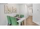Cozy dining area with a white table, green chairs, and tasteful wall decor at 537 Trading Post Ln, York, SC 29745