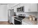 This kitchen features stainless steel appliances and granite countertops, offering a modern and stylish space at 537 Trading Post Ln, York, SC 29745