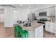 Modern kitchen features granite countertops, stainless steel appliances, and green barstools at the kitchen island at 537 Trading Post Ln, York, SC 29745