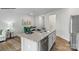 Modern kitchen featuring a granite island, stainless steel appliances, and an adjacent dining area at 537 Trading Post Ln, York, SC 29745