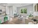 Inviting living area with stylish furniture, a work space, and natural light from a large window at 537 Trading Post Ln, York, SC 29745