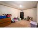 Spacious basement area with carpet, ample storage, and a secure black safe for valuables at 5448 Bill Sain Rd, Vale, NC 28168
