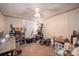 Cozy bedroom features a ceiling fan, neutral walls and carpet, and ample storage space on shelves and containers at 5448 Bill Sain Rd, Vale, NC 28168