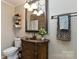 Charming bathroom vanity with decorative fixtures at 601 Highland Forest Dr, Charlotte, NC 28270