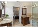 Elegant bathroom featuring dual vanities with granite countertops and a separate tub, connected to a bedroom at 601 Highland Forest Dr, Charlotte, NC 28270