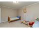 Cozy bedroom featuring carpeted floors, neutral walls, and a wood bed frame at 601 Highland Forest Dr, Charlotte, NC 28270