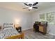 Well-lit bedroom with a bed, desk, and ample natural light, perfect for studying or relaxing at 601 Highland Forest Dr, Charlotte, NC 28270