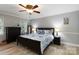 Spacious bedroom features wood-look floors, ceiling fan, and stylish decor for a comfortable retreat at 601 Highland Forest Dr, Charlotte, NC 28270