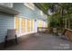 Backyard deck area with double doors leading into the home at 601 Highland Forest Dr, Charlotte, NC 28270