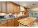 Kitchen featuring custom cabinets, granite countertops, stainless steel appliances and center island at 601 Highland Forest Dr, Charlotte, NC 28270