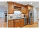 Kitchen features custom wood cabinets with granite countertops and stainless steel appliances at 601 Highland Forest Dr, Charlotte, NC 28270