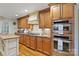 Gourmet kitchen featuring stainless steel appliances, granite countertops, custom cabinetry, and center island at 601 Highland Forest Dr, Charlotte, NC 28270