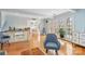Sunlit living room with hardwood floors, large windows, and access to an outdoor deck at 601 Highland Forest Dr, Charlotte, NC 28270