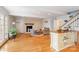Cozy living room boasts fireplace, hardwood floors, natural light, and is perfect for relaxation at 601 Highland Forest Dr, Charlotte, NC 28270