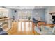 Bright living room boasts hardwood floors, large windows, and access to an outdoor deck at 601 Highland Forest Dr, Charlotte, NC 28270