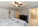 Serene main bedroom with ceiling fan, en-suite bathroom, and ample closet space, ideal for relaxation at 601 Highland Forest Dr, Charlotte, NC 28270