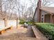 Spacious wooden back deck featuring built-in benches and comfortable striped seating at 6200 Summertree Ln, Charlotte, NC 28226