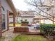 Cozy outdoor deck featuring comfortable striped seating, perfect for relaxing and entertaining at 6200 Summertree Ln, Charlotte, NC 28226