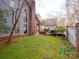 Beautiful backyard featuring green grass and a wooden deck, ideal for outdoor enjoyment at 6200 Summertree Ln, Charlotte, NC 28226