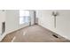 Bedroom with neutral carpet, natural light, and a built-in wall lamp for comfortable reading at 6200 Summertree Ln, Charlotte, NC 28226