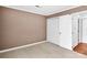 Cozy bedroom featuring neutral tones, closet, and a doorway to another room at 6200 Summertree Ln, Charlotte, NC 28226