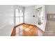 Bright breakfast nook with hardwood floors, natural light, and access to the backyard at 6200 Summertree Ln, Charlotte, NC 28226