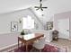 Attic home office with vaulted ceilings, natural light, a ceiling fan, and modern decor at 6200 Summertree Ln, Charlotte, NC 28226