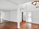 Bright, airy living room with hardwood floors and high ceilings, mirrored wall at 6200 Summertree Ln, Charlotte, NC 28226