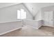 Open loft space with a window and neutral paint, perfect for a home office or living area at 6200 Summertree Ln, Charlotte, NC 28226