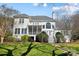 Expansive backyard featuring a screened porch, large windows, and lush greenery, perfect for outdoor relaxation at 6403 Amos Smith Rd, Charlotte, NC 28214