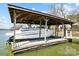 Covered boat lift offering protection for your vessel and easy access to the water, enhancing waterfront living at 6403 Amos Smith Rd, Charlotte, NC 28214
