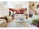 Open living space with high ceilings, neutral decor, and a staircase leading to the second floor at 6403 Amos Smith Rd, Charlotte, NC 28214
