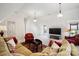 Spacious and inviting living room, bathed in natural light with plush sofa and charming decor at 6403 Amos Smith Rd, Charlotte, NC 28214