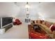 Loft with sectional couch, television, and decorative rugs, perfect for entertaining at 6403 Amos Smith Rd, Charlotte, NC 28214