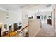 Bright living room with staircase, fireplace, and a view of the outdoor balcony at 6403 Amos Smith Rd, Charlotte, NC 28214