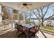 Beautiful screened-in porch with outdoor seating offering serene lake views at 6403 Amos Smith Rd, Charlotte, NC 28214
