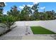 This backyard features artifical turf and modern landscaping at 769 River Park Rd, Belmont, NC 28012