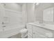 Clean, all-white bathroom featuring a tub and shower combo, modern vanity, and bright lighting at 769 River Park Rd, Belmont, NC 28012