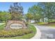 Stone entrance sign for Water's Edge community surrounded by manicured landscaping at 769 River Park Rd, Belmont, NC 28012