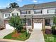 Beautiful townhome exterior with stone accents, attached garage, and well-maintained landscaping at 769 River Park Rd, Belmont, NC 28012