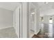 Bright hallway leading to a modern bathroom and spacious living area, highlighting the open layout at 769 River Park Rd, Belmont, NC 28012