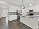 Modern kitchen with stainless steel appliances, granite countertops, and white cabinetry, offering ample storage at 769 River Park Rd, Belmont, NC 28012