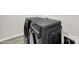 This laundry room features modern, gray, front-load washing and drying machines at 769 River Park Rd, Belmont, NC 28012